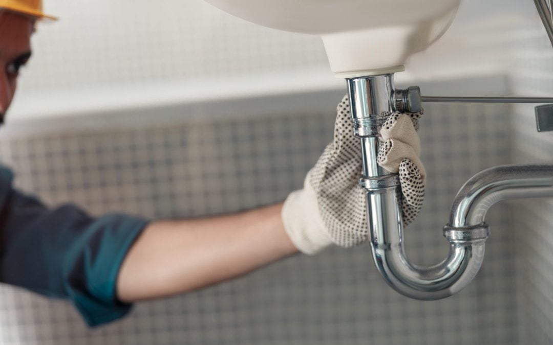 close-up-of-plumber-is-repairing-faucet-at-bathroom